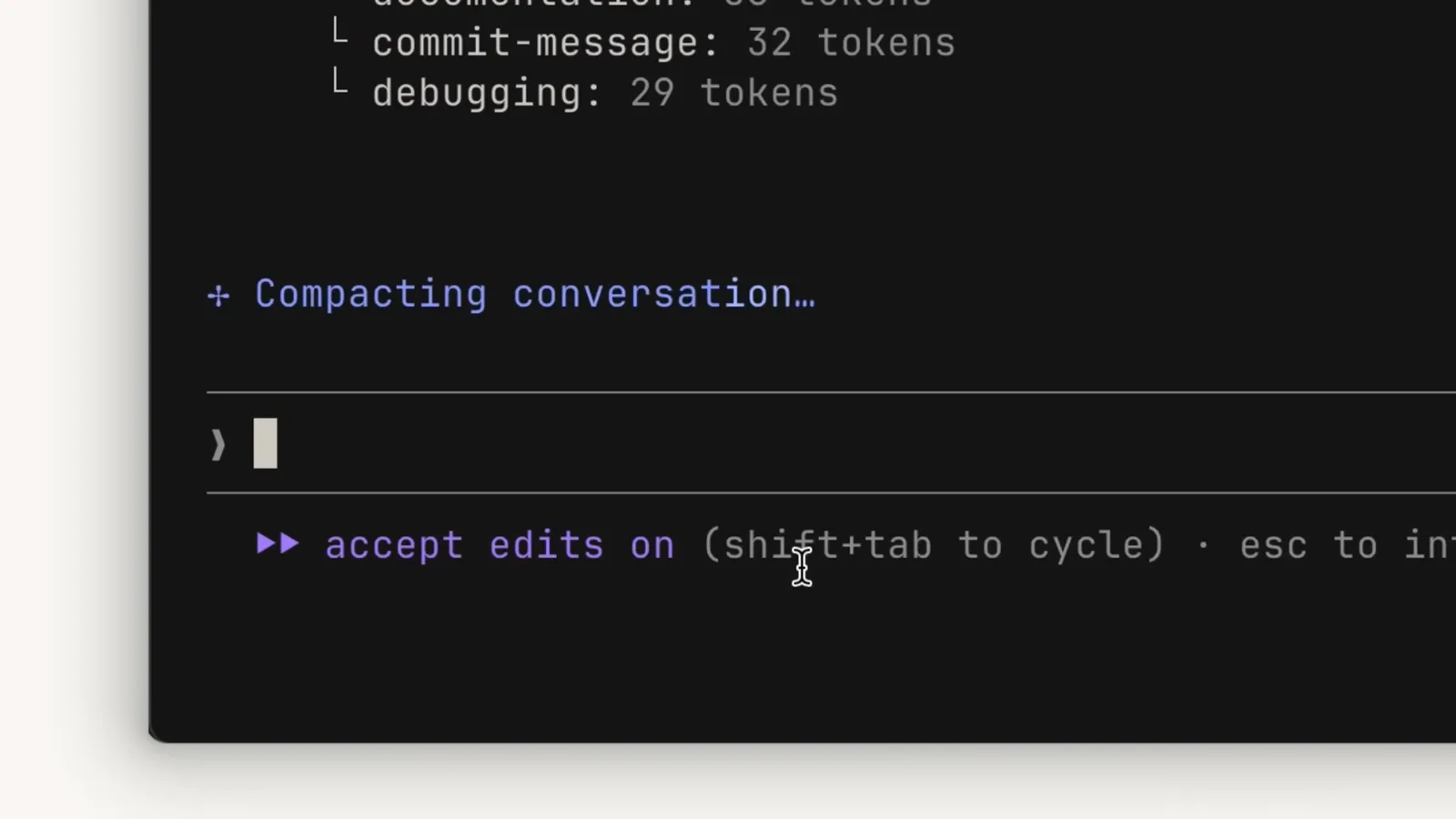 Autocompact kicks in near the limit Claude Code showing the Compacting conversation status above an empty input box while accept edits mode is on, the moment automatic compaction summarizes important details and clears older tool results near the context limit