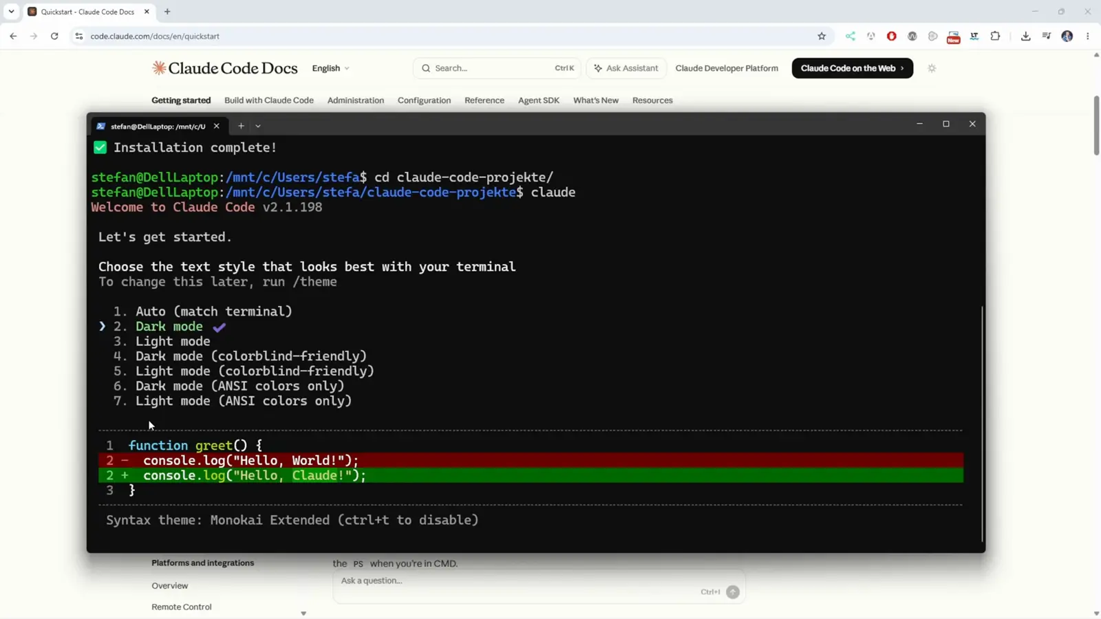Claude Code first-run theme picker titled Choose the text style that looks best with your terminal, with Dark mode selected above a green and red Hello World preview